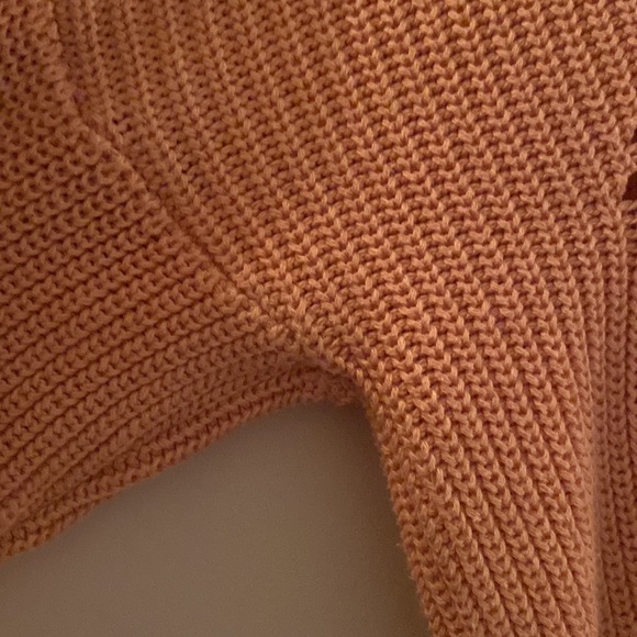 A coral sweater. - Picture 2 of 3